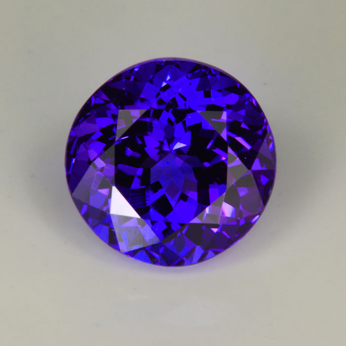round brilliant cut tanzanite gemstone red flash