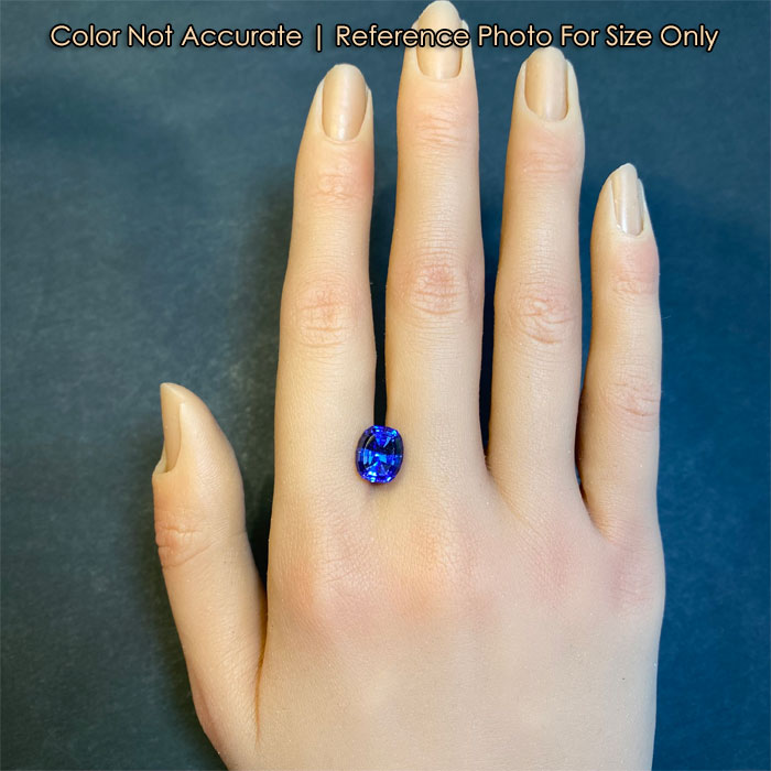 antique cushion tanzanite on hand size reference