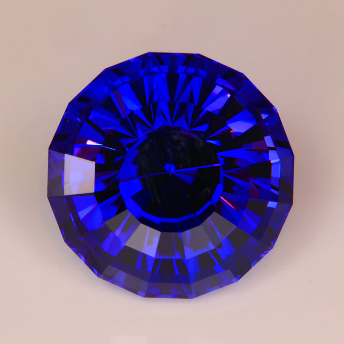 stepped round tanzanite gem perfect color red flash