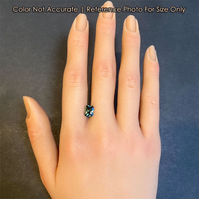 sapphire gemstone on hand for size