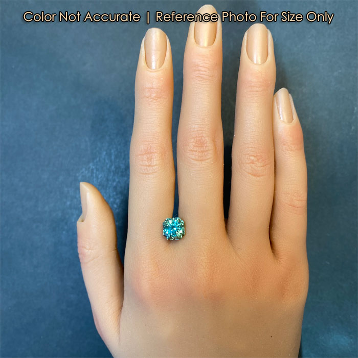 square tourmaline gemstone on hand