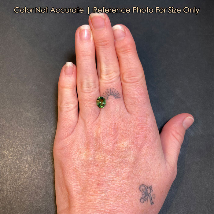 size of green tourmaline gemstone on hand
