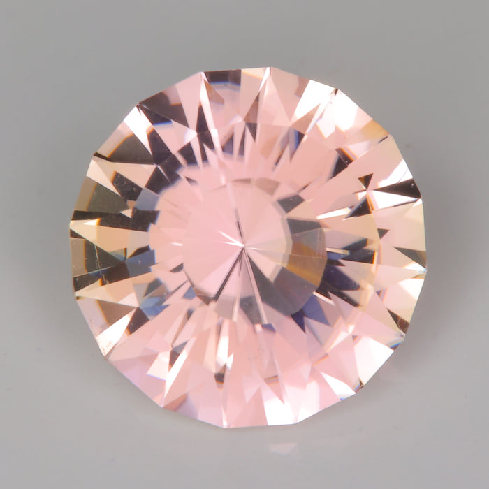 slightly peachy pink tourmaline gemstone round brilliant cut