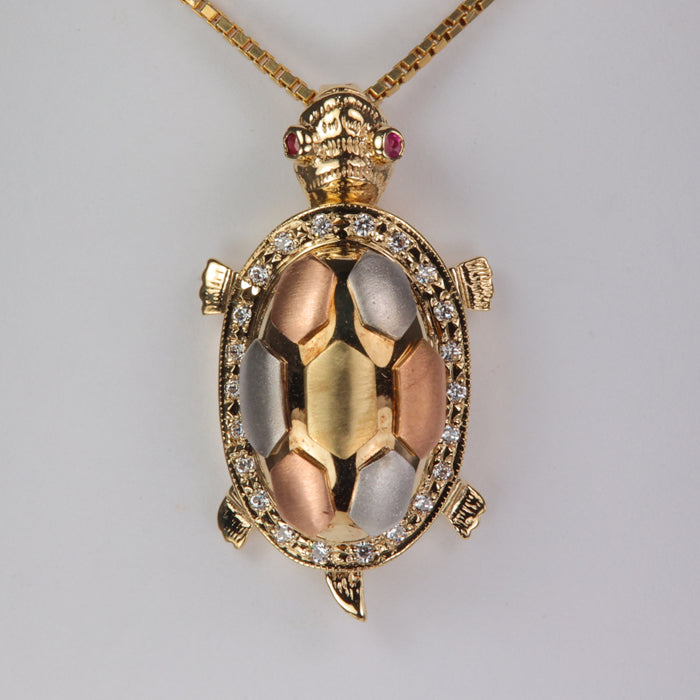 yellow white and rose gold turtle pendant with ruby eyes and cubic zirconia