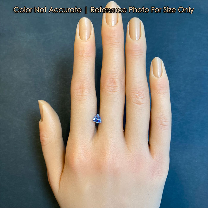 violet blue sapphire on hand