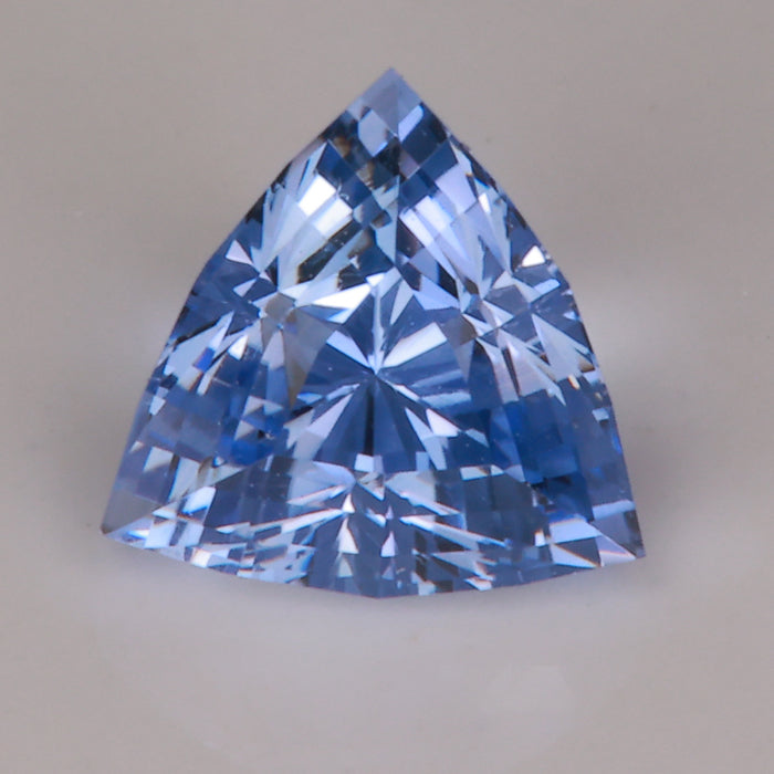 slightly violet blue sapphire gemstone trilliant cut 