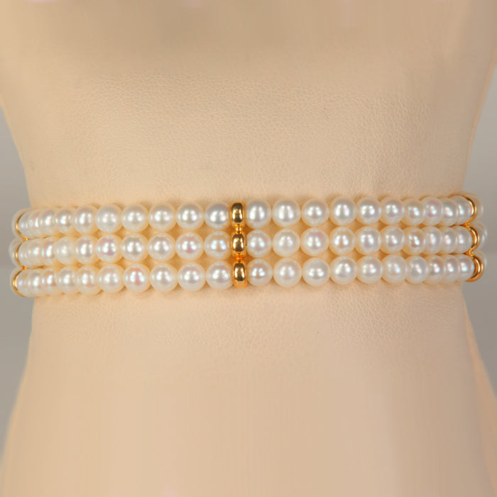 yellow gold and pearl triple strand bracelet