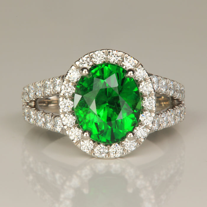 oval cut tsavorite and diamond ring in platinum