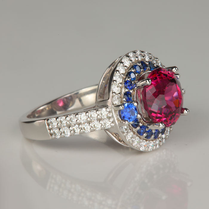 umbalite garnet ring with diamonds and sapphires