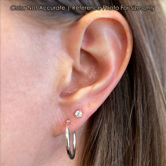 white gold hoops on ear