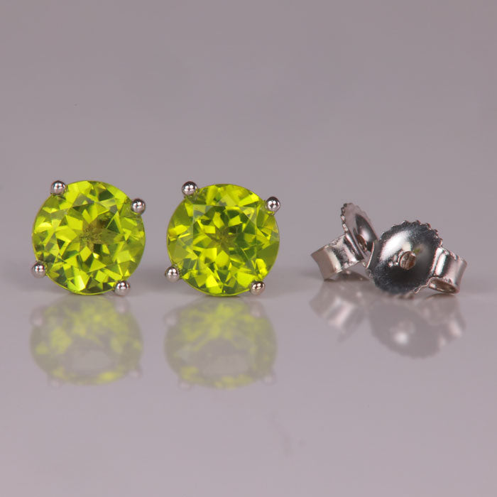 white gold and green peridot gemstone earrings 