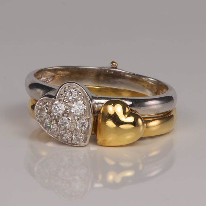 heart ring set in white and yellow gold hinged band with cubic zirconia accents