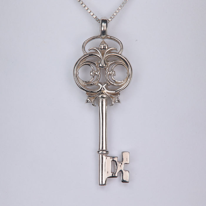 key pendant in white gold