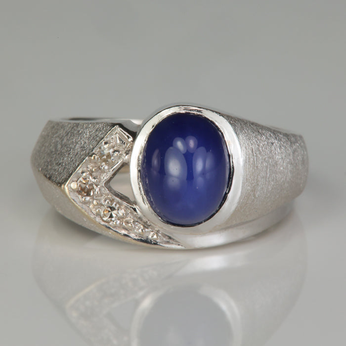 white gold synthetic star sapphire ring with diamond accents