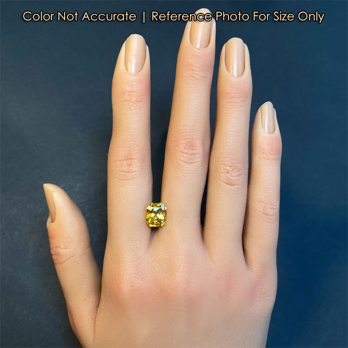 sapphire gemstone on hand for size