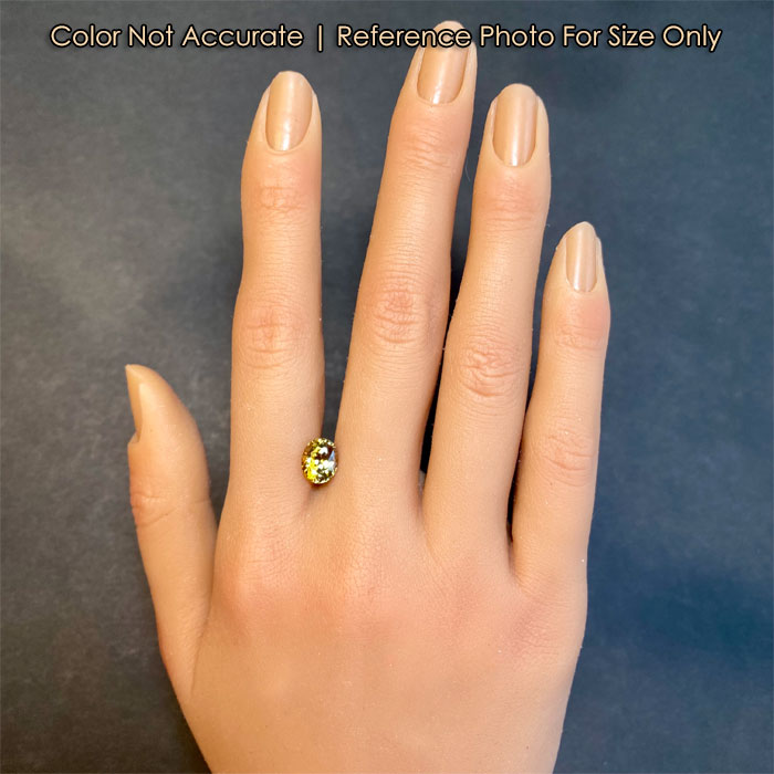 tanzanite gemstone yellow on hand