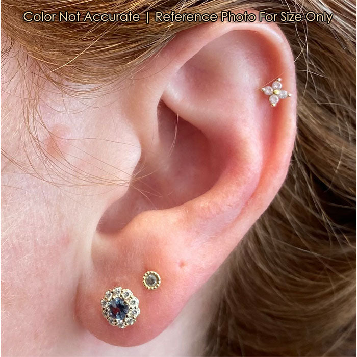 yellow gold alexandrite studs on ear