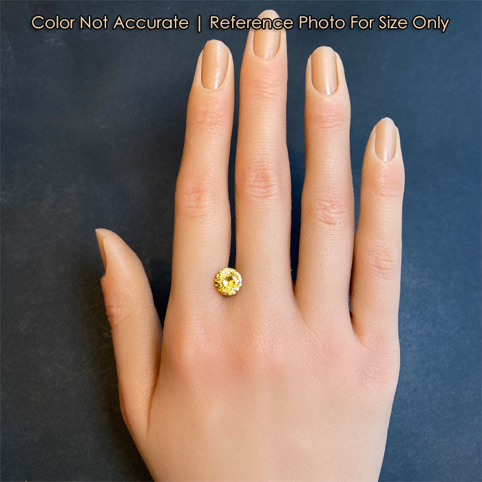 size reference of yellow zircon to hand