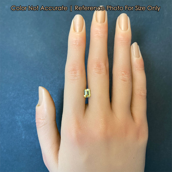 emerald cut yellow sapphire size to hand