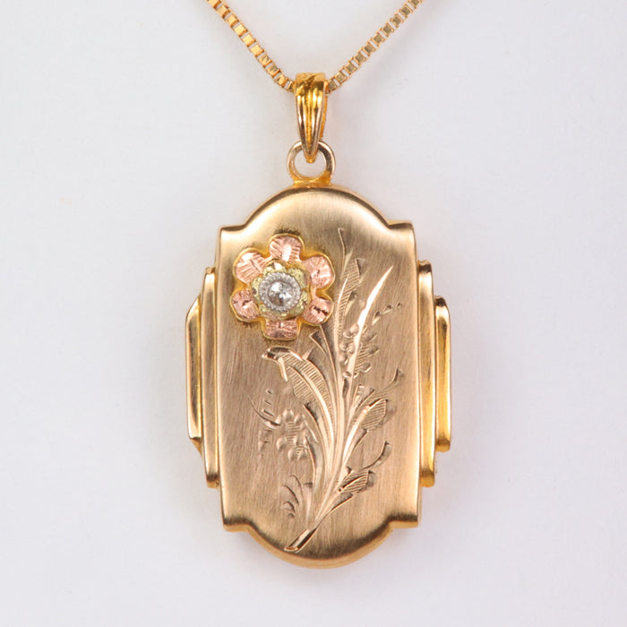 Yellow and rose gold locket with flower detail and diamond accent