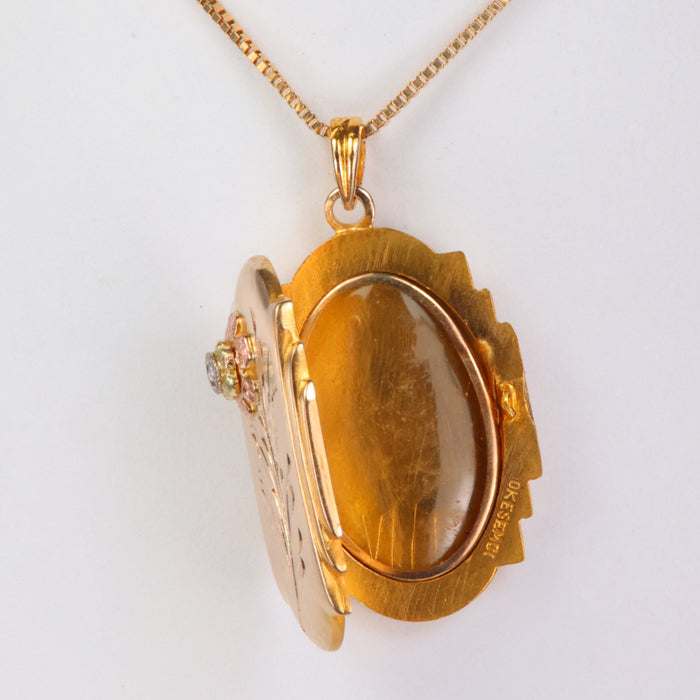 diamond accented yellow and rose gold locket pendant