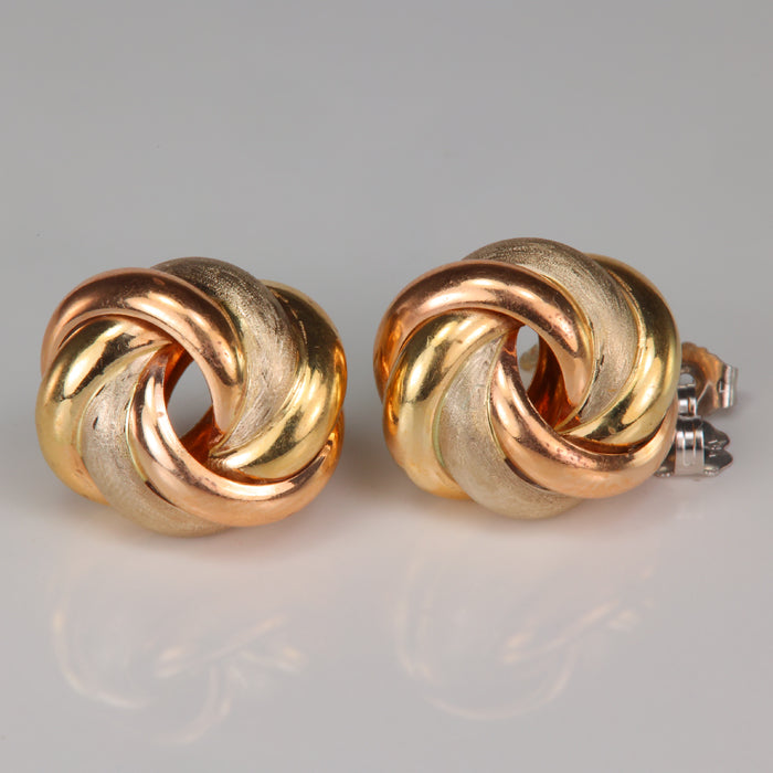 Knot style stud earrings in yellow and rose gold