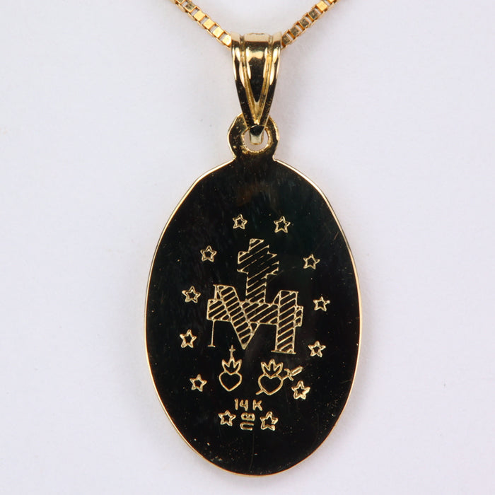 engraving on back of Virgin Mary pendant