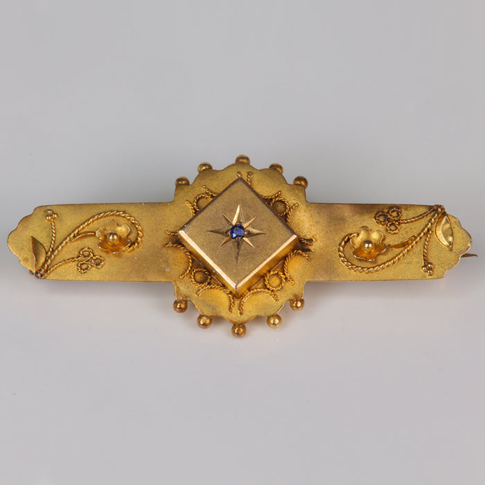 yellow gold estate vintage Victorian pin with blue stone