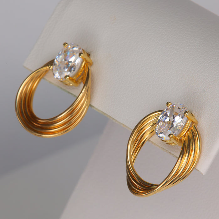 cubic zirconia and yellow gold swirl studs
