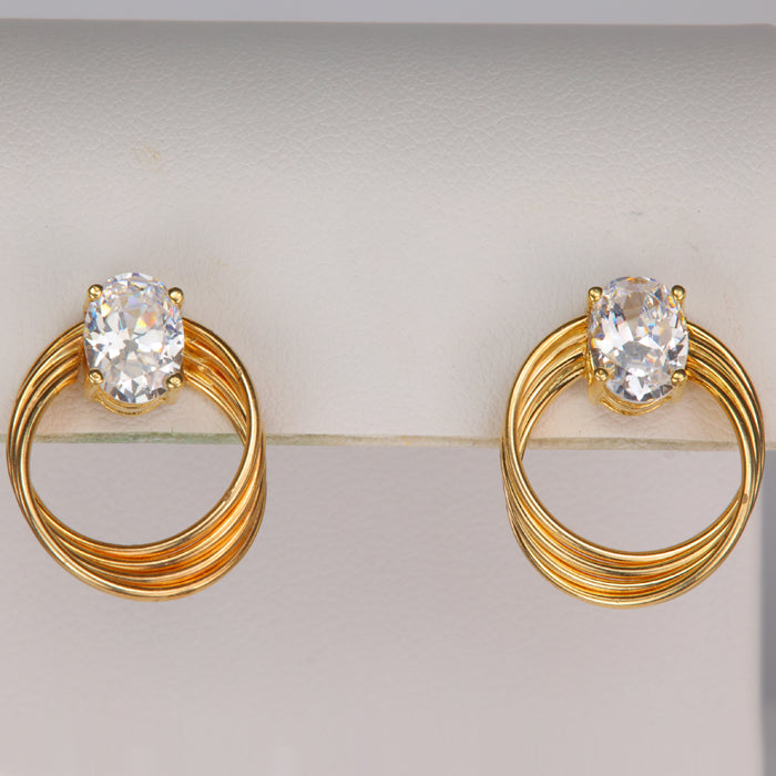 Yellow gold swirl style earrings with cubic zirconia 