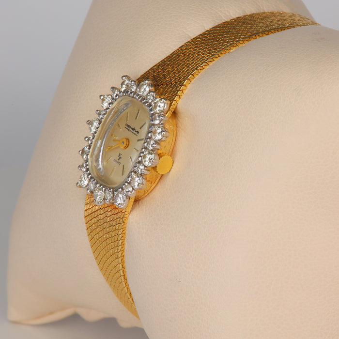 gold Geneve watch with diamonds