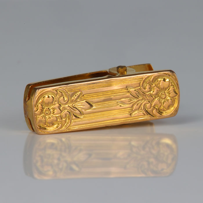 estate clip with flower detail in yellow gold