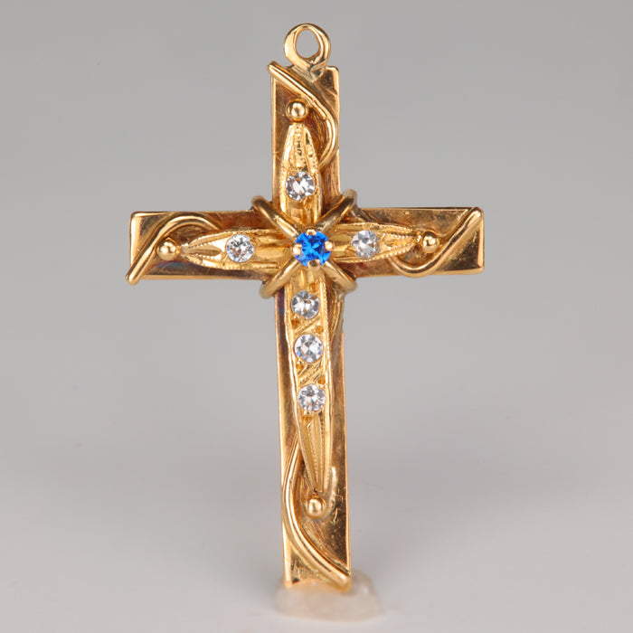 estate cross pendant in yellow gold with white and blue stones