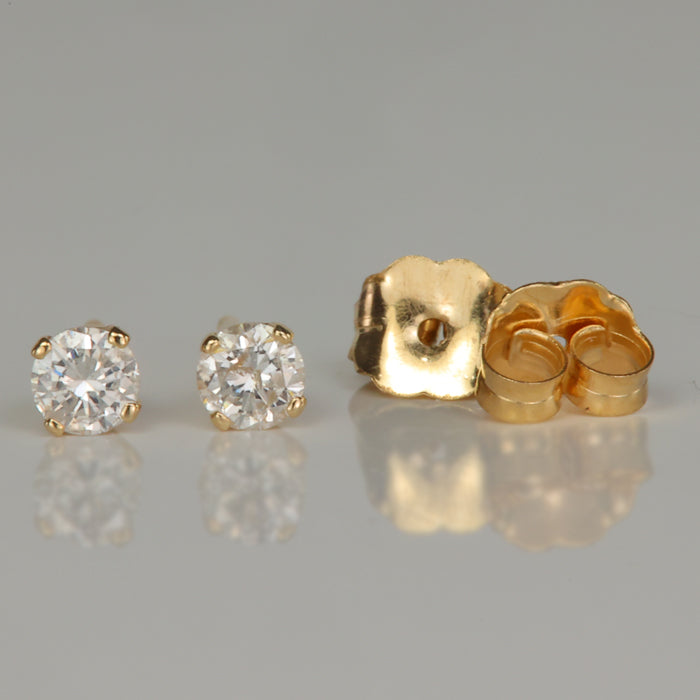 diamond stud earrings in yellow gold