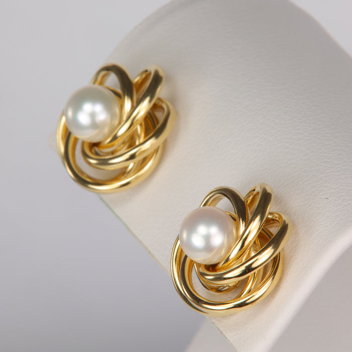 gold earring jackets shown with pearl studs