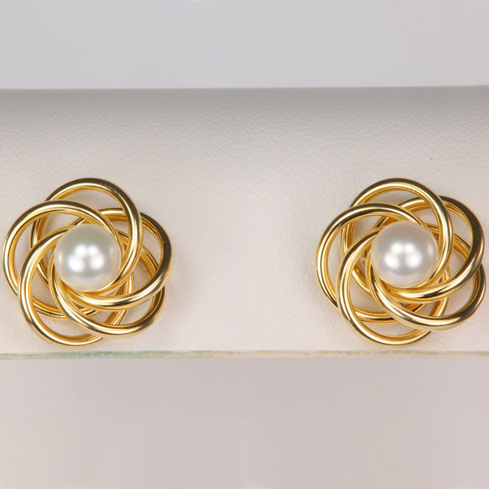 gold earring jackets shown with pearl studs