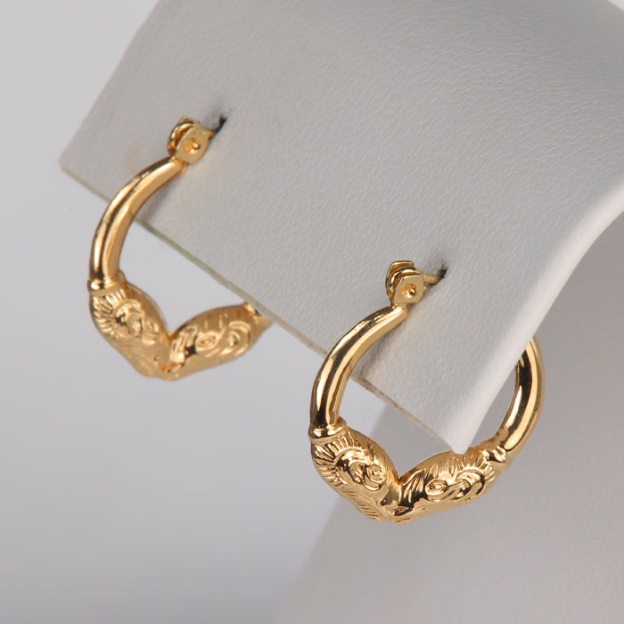 yellow gold hoop earrings with ram detail