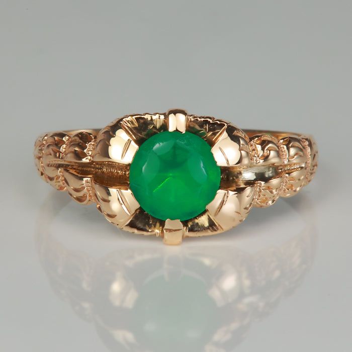 Green glass gemstone ring in yellow gold