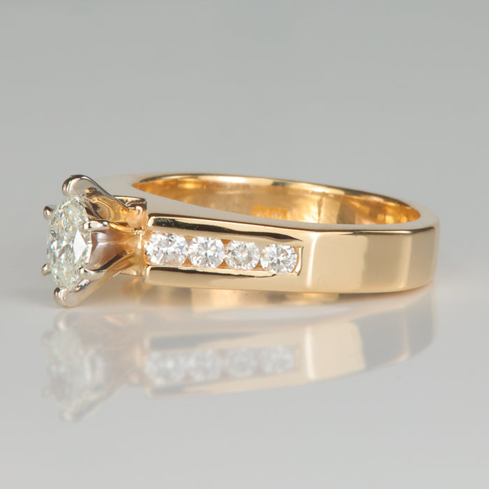 yellow gold ring with marquise and round cut diamonds