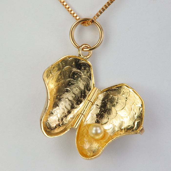 gold oyster pendant with pearl 