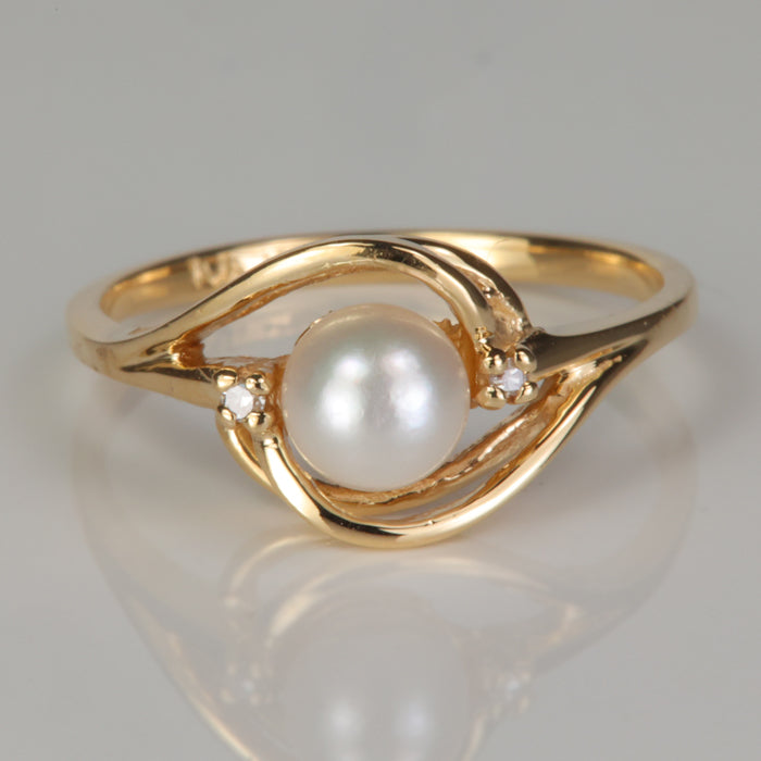 Yellow gold estate ring with pearl and diamond accents