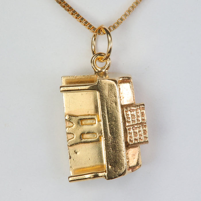 piano pendant charm in yellow gold 
