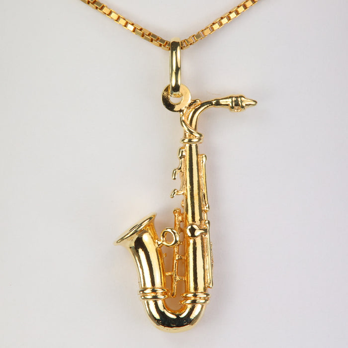 gold saxophone estate pendant 
