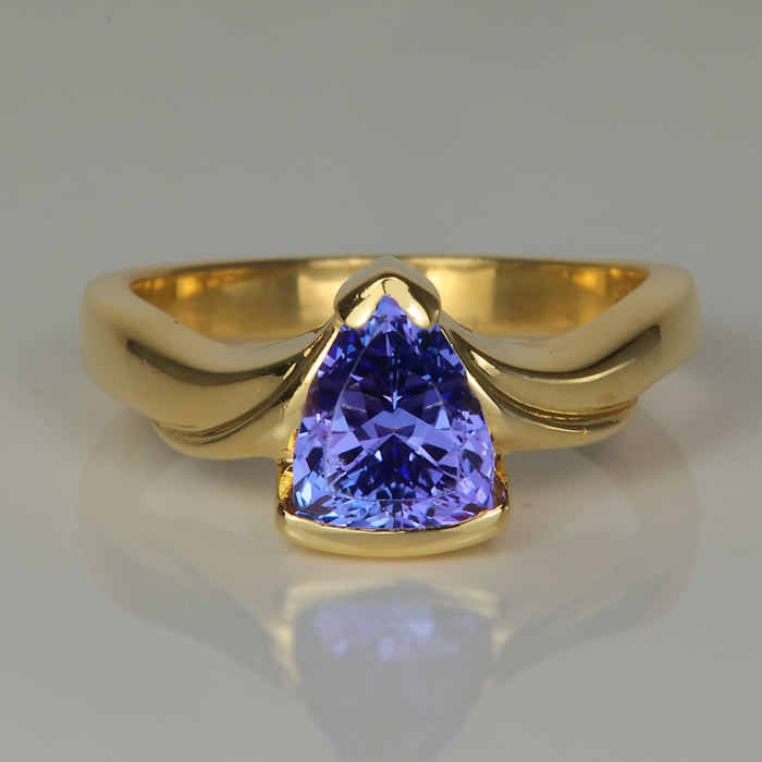 shield cut blue violet tanzanite gemstone ring in yellow gold