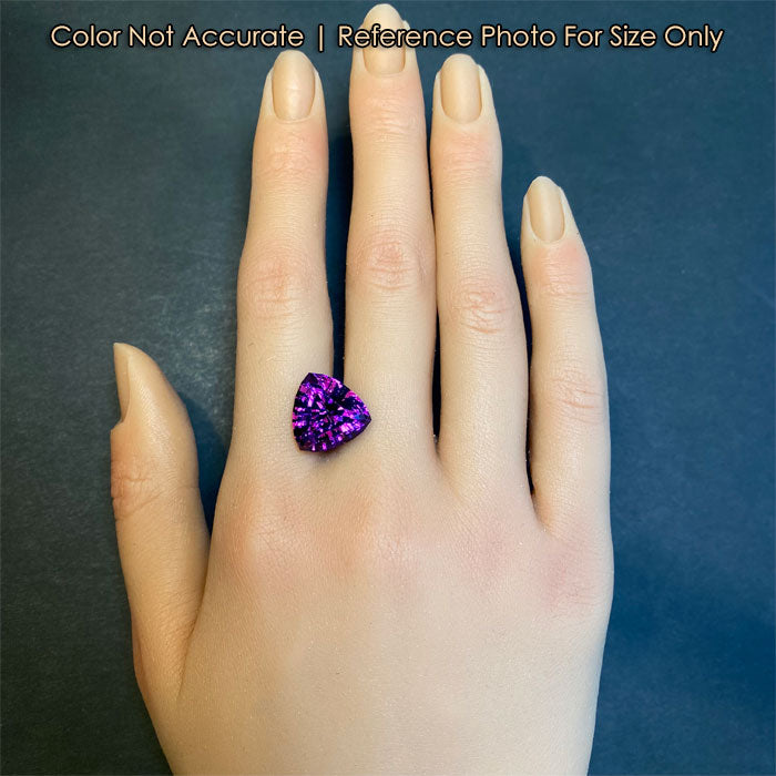 purple amethyst gemstone on hand 