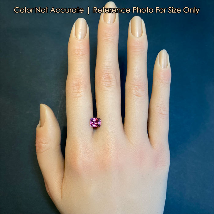 garnet gemstone on hand for size