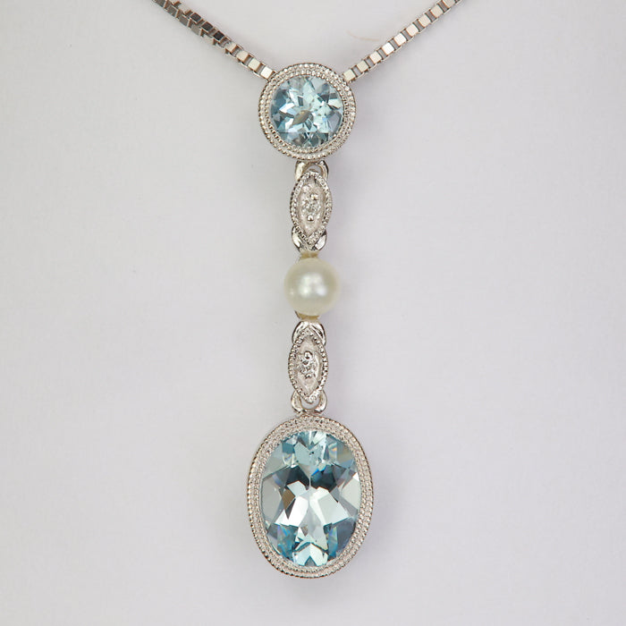aquamarine gemstone pendant in white gold with pearl accent and diamonds