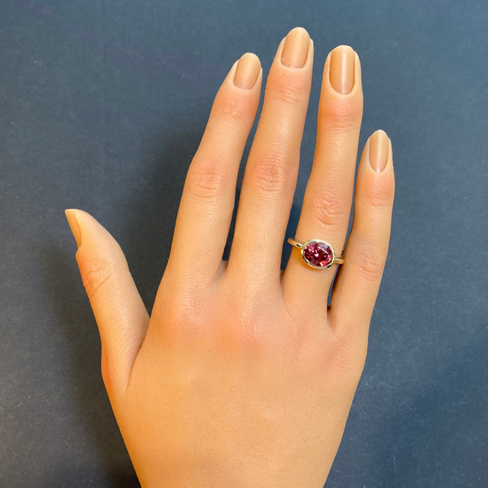 bezel set mahenge garnet ring in yellow gold