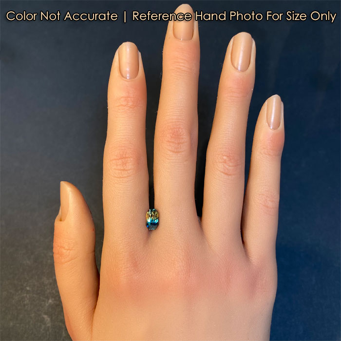 green yellow bicolor sapphire gem on hand