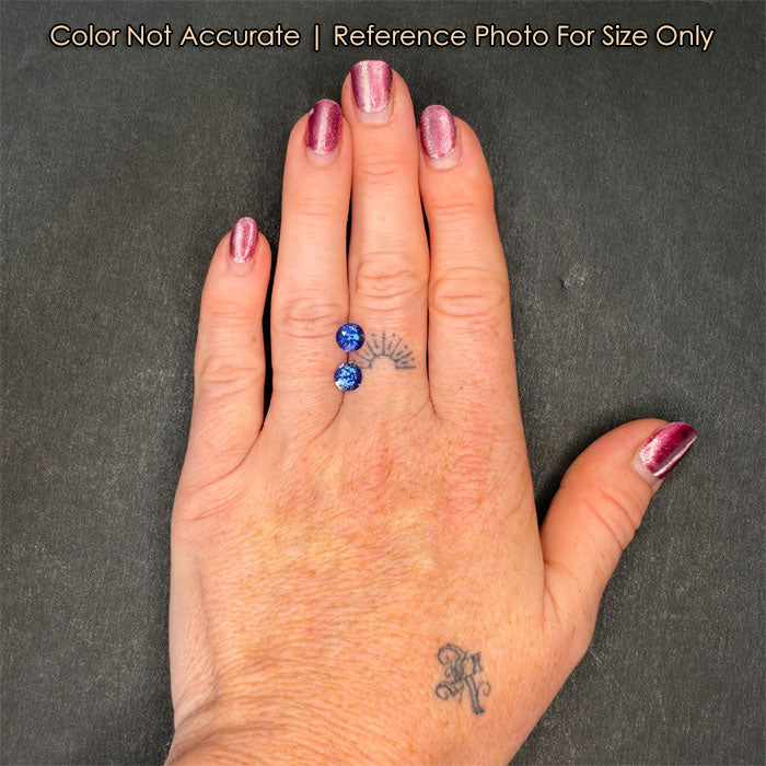 round cut sapphire gemstones on hand size